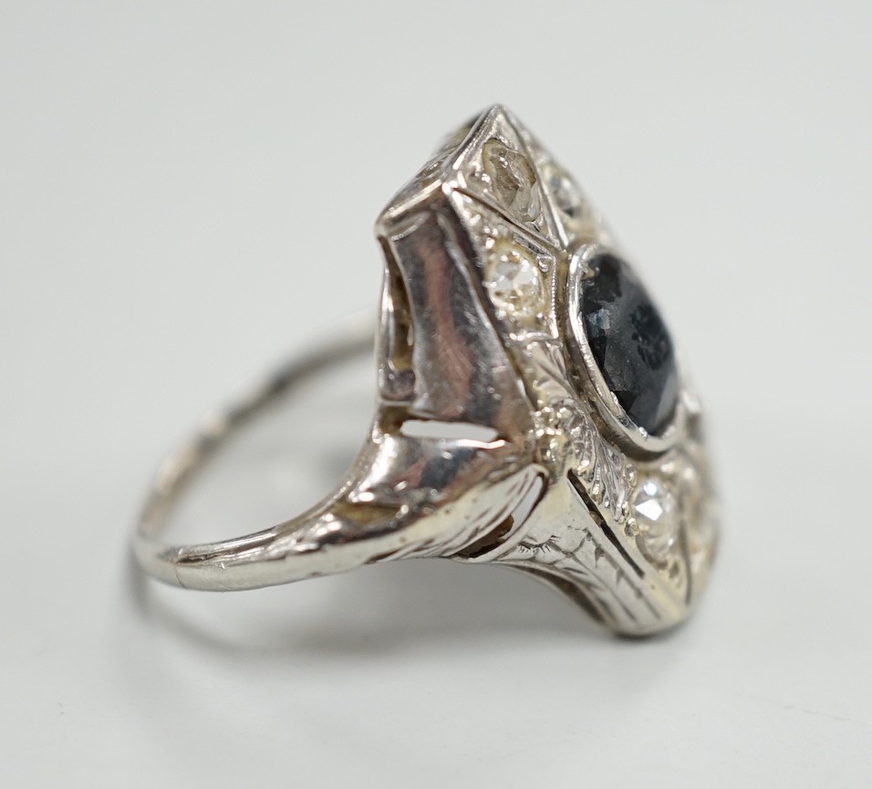 A 1940's? white metal, sapphire and diamond cluster set hexagonal dress ring, size L, gross weight 4.6 grams.